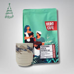 Dovanų rinkinys: R. Dagio keramikinis puodelis ir kava 200 g VERO CAFE Baltas ~400 ml Tanzania Ngila AA 200 g 