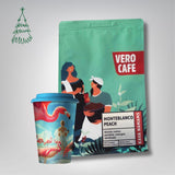 Dovanų rinkinys: Kava 200 g ir daugkartinis puodelis su A. Kriščiūno kūryba 473 ml VERO CAFE Columbia Monteblanco Peach 200 g Malta 